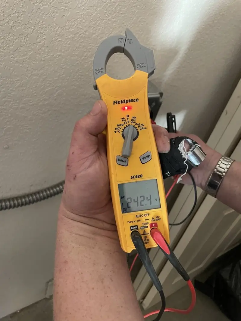 Voltage testing with clamp meter during Whole House Surge Protector in Nowata